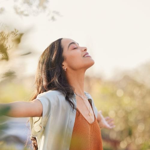 Serene latin woman enjoy sunset with gratitude